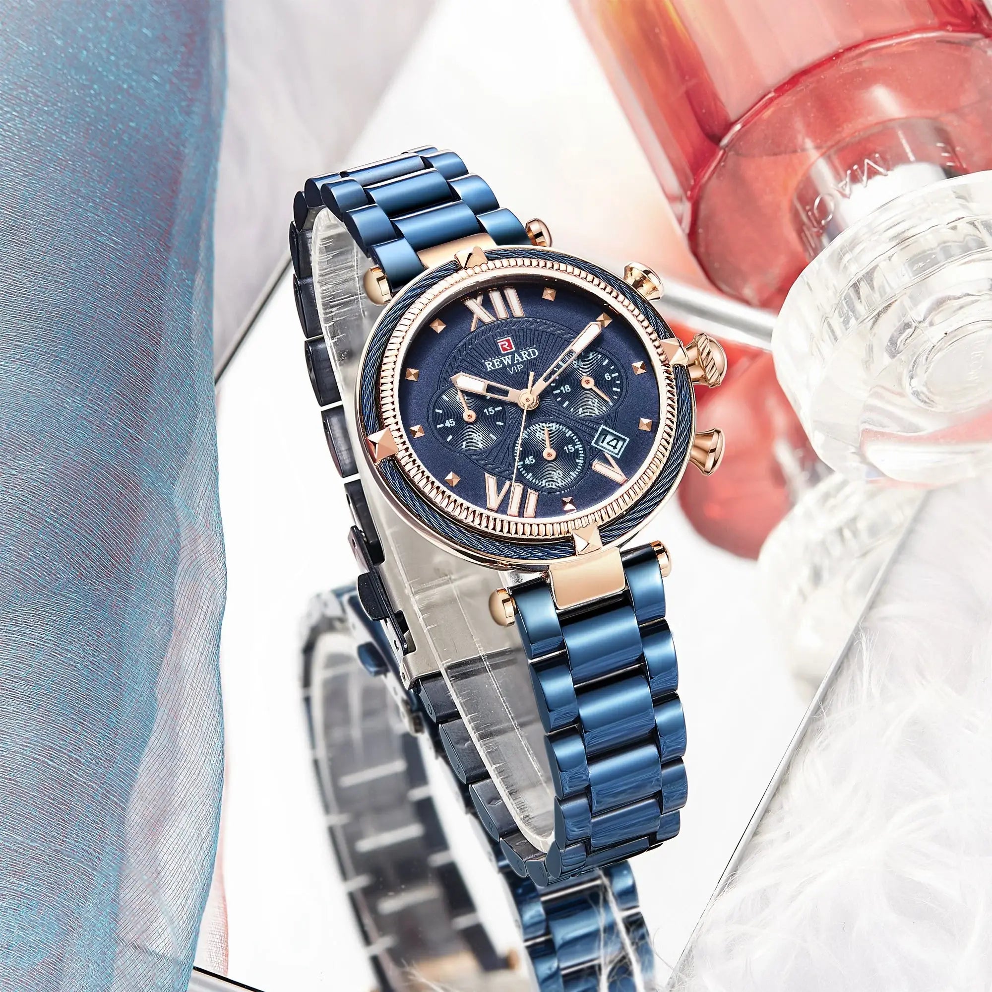Blue watch with a detailed face on a blurred background