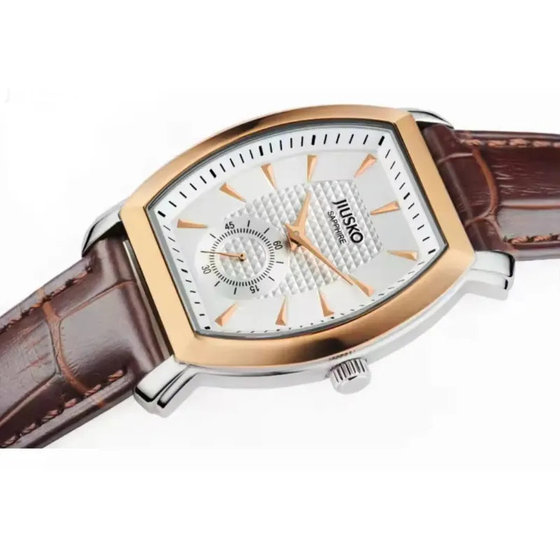 Watch with brown leather strap and rose gold accents on a white background