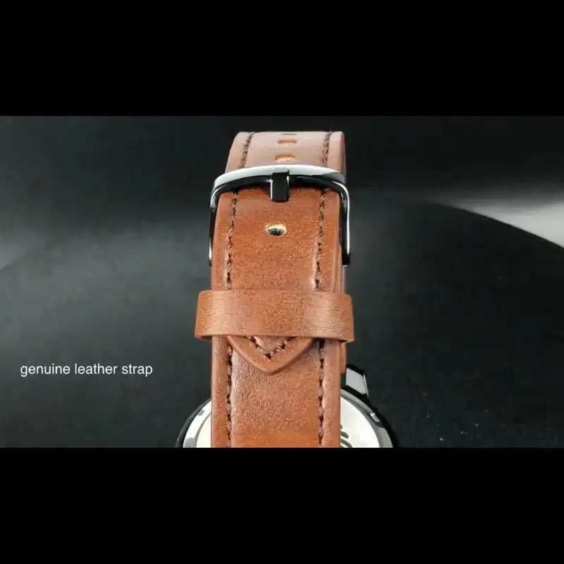 Close-up of the EYKI genuine brown leather strap with a polished black buckle and durable stitching. Find affordable watches at our online watch store in Canada.
