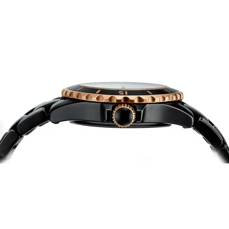 Close-up of a watch with black and rose gold design on a white background
