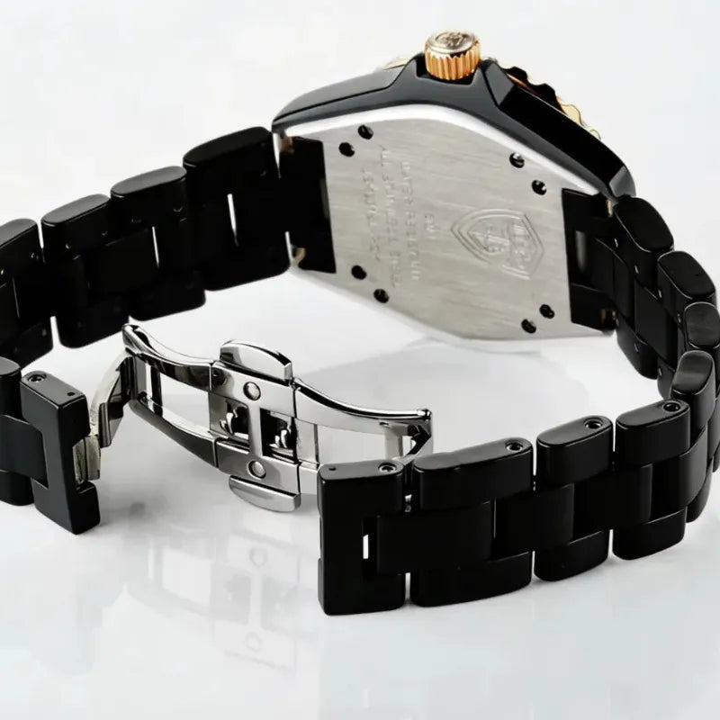 Black metal watch with visible brand logo on a white background