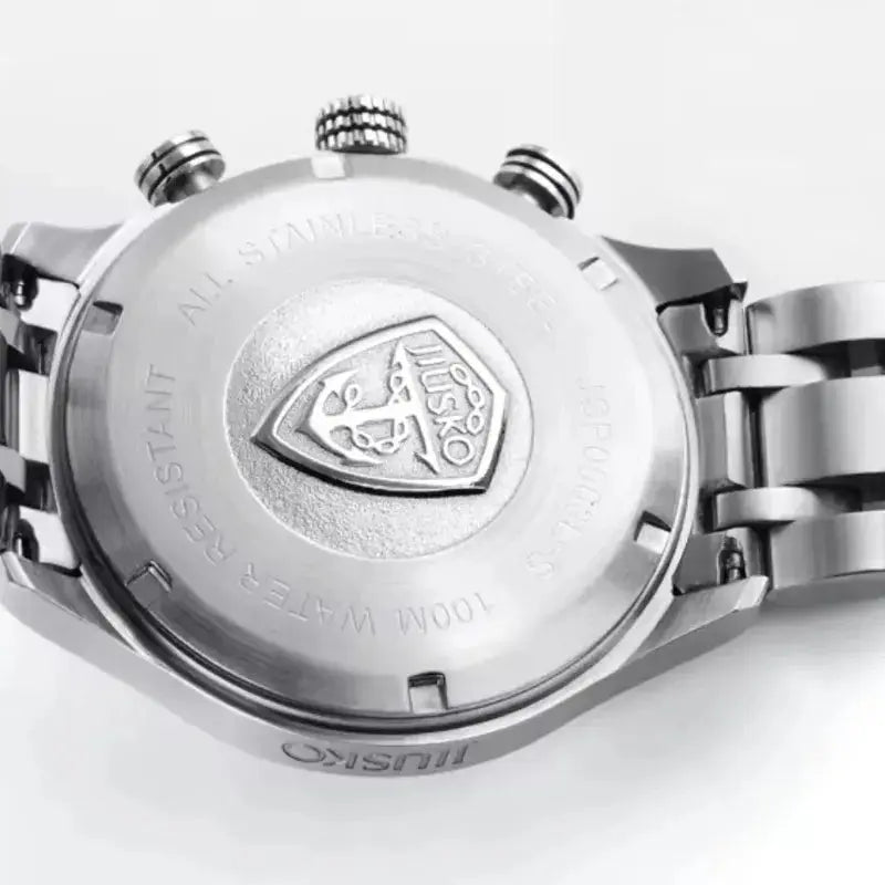 Close-up of a silver watch with a brand logo on a white background