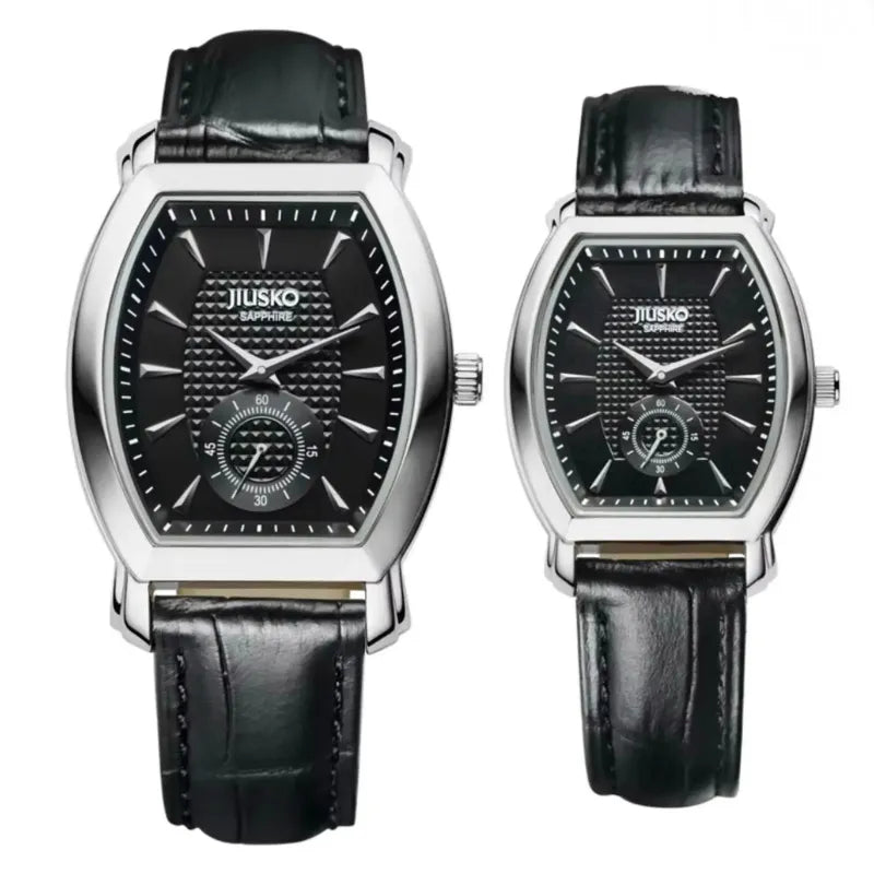 Two black wristwatches with silver accents on a white background