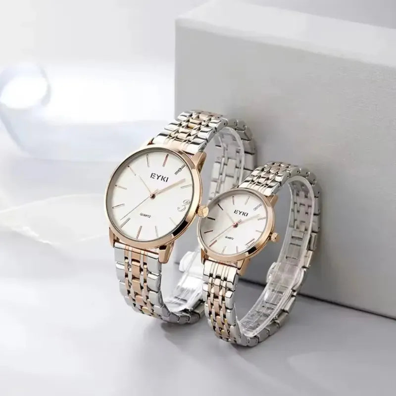 Two watches with rose gold and silver bands on a white background