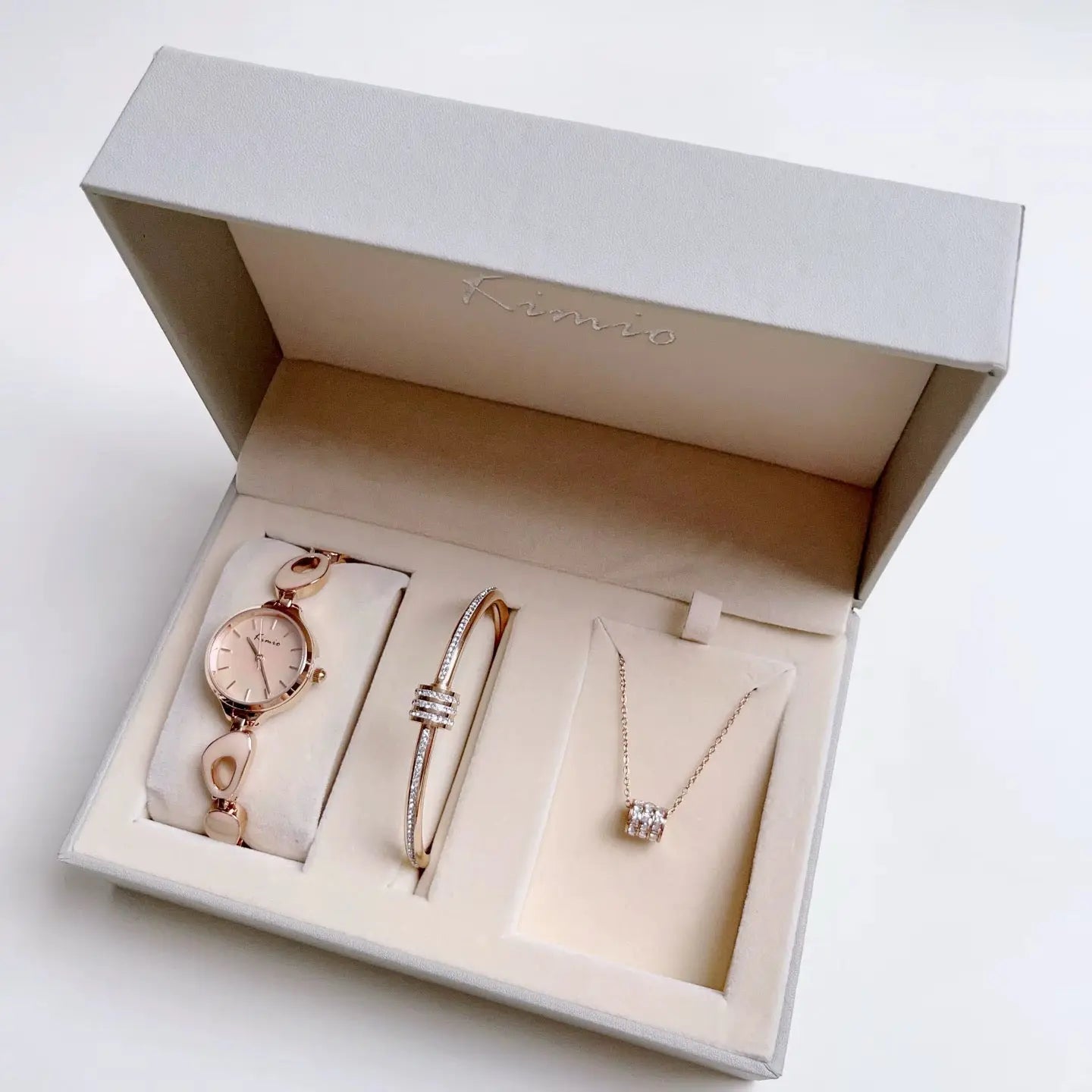 Women's Watch set including Beige color nacklace on white background.