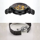 Black wristwatch with detailed face and metal band on a white background