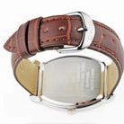 Brown leather belt with silver buckle on a white background