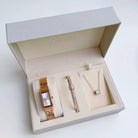 Jewelry set with watch, pen, and necklace in a Kiera box on a white background