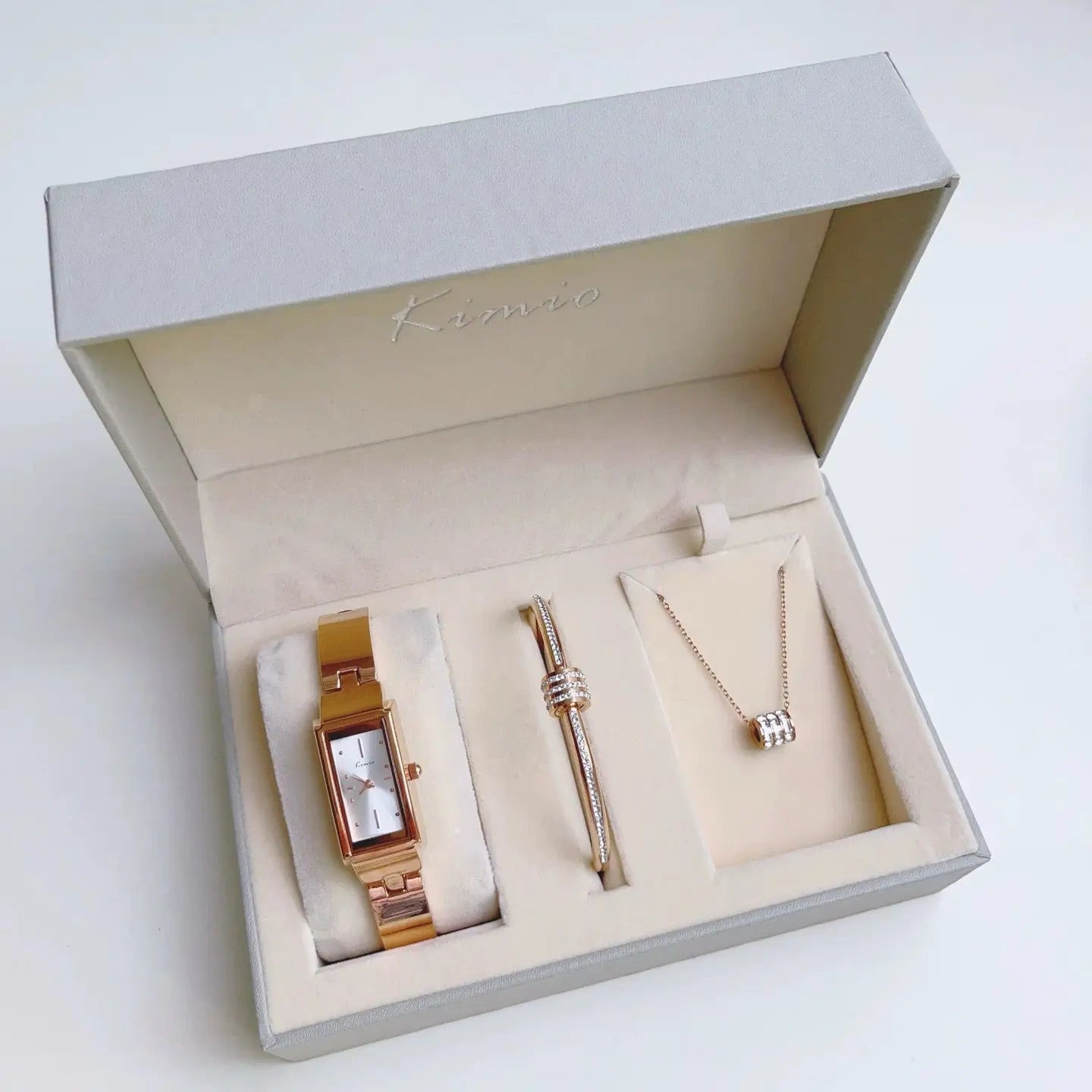 Jewelry set with watch, pen, and necklace in a Kiera box on a white background