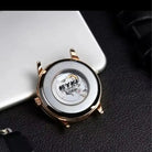 Transparent stainless steel back of an EYKI automatic watch showing internal gears. Quality affordable watches from a Canadian online store.