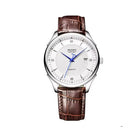 Watch with brown leather strap and white dial on a white background