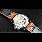 EYKI stainless steel watch back with engraved wing logo and genuine brown leather straps. Shop affordable watches at our online watch store in Canada.