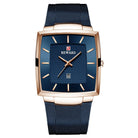 Blue watch with rose gold accents on a white background