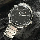 Close detail of the silver stainless steel bezel and buttons on a multifunctional watch. Affordable watches at our online watch store in Canada.