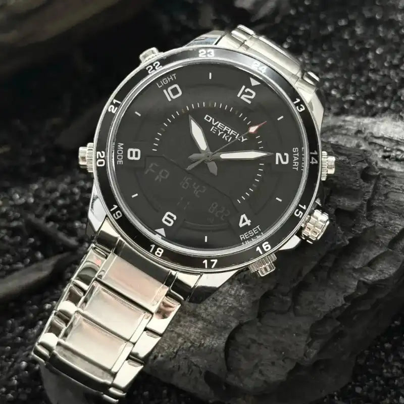 Close detail of the silver stainless steel bezel and buttons on a multifunctional watch. Affordable watches at our online watch store in Canada.