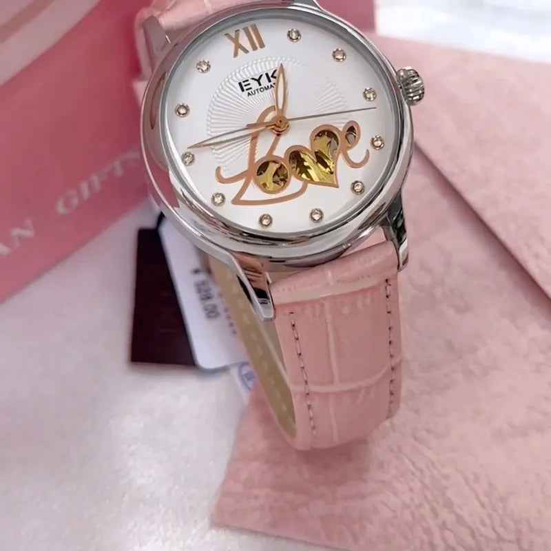 Pink watch with 'love' text on a pink background