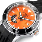 Orange watch with black and silver accents on a white background