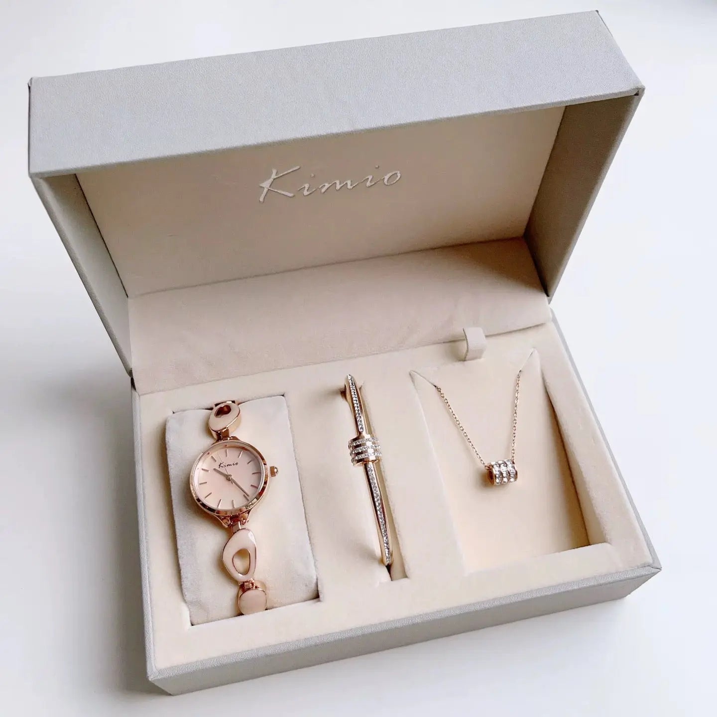 Women's Watch set including Beige color nacklace on white background.
