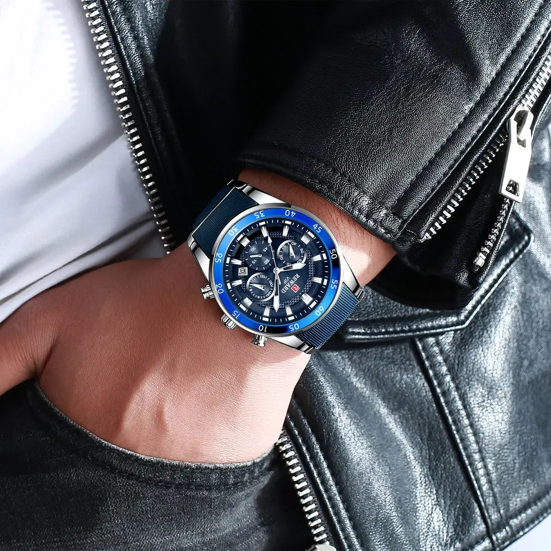 Hand wearing a blue and silver watch with a black leather jacket background