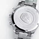 Close-up of a silver watch with brand logo on a white background