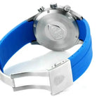 Wristwatch with blue strap and silver case on a white background
