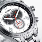 Close-up of a silver watch with black face and red accents, brand 'JIUSKO' visible.