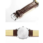 Watch with a brown and beige leather strap on a white background