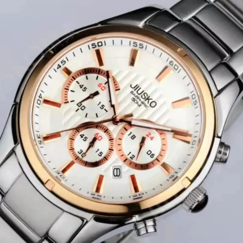 Silver and rose gold watch with white face on a light gray background